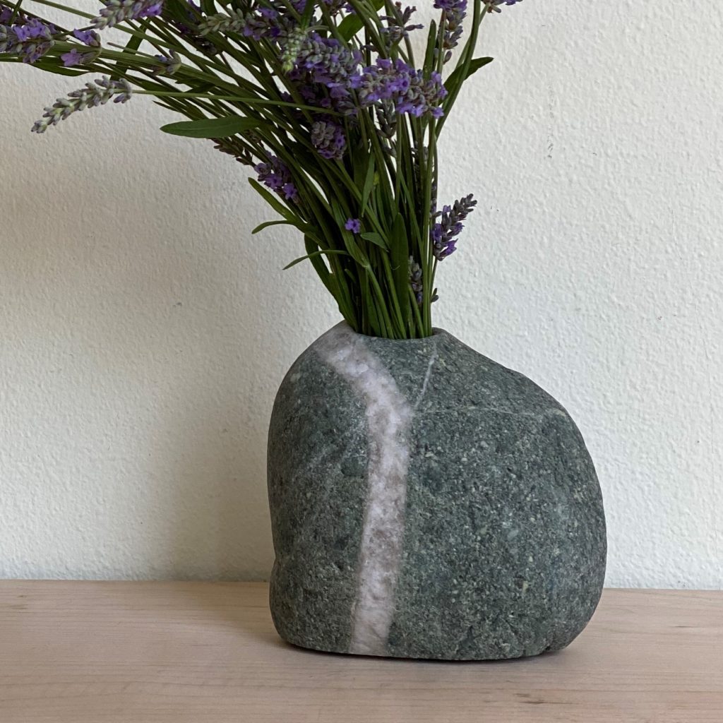 stone vase holding lavendar